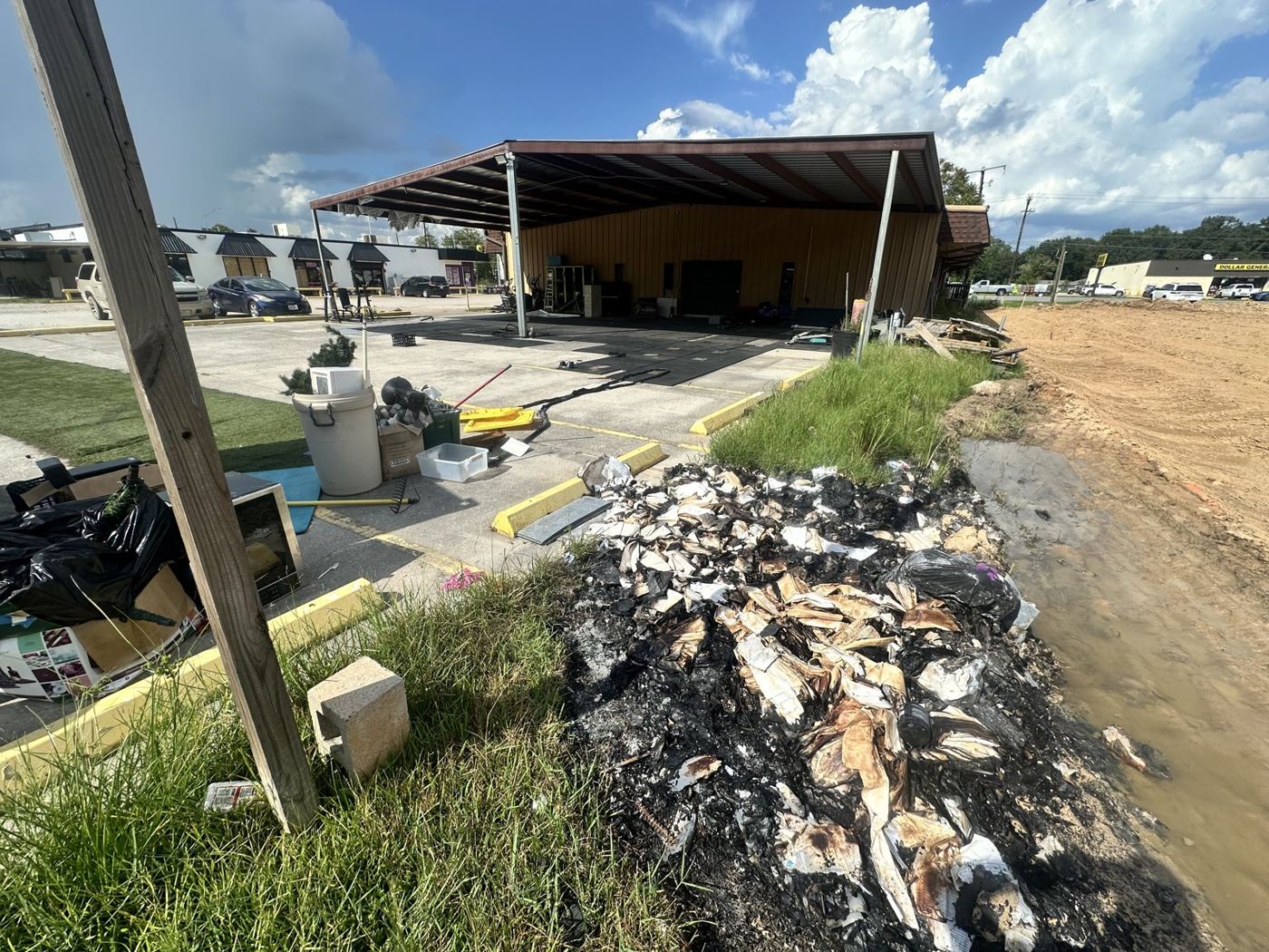 Pile of yard and construction debris on a commercial lot, ready for the truck