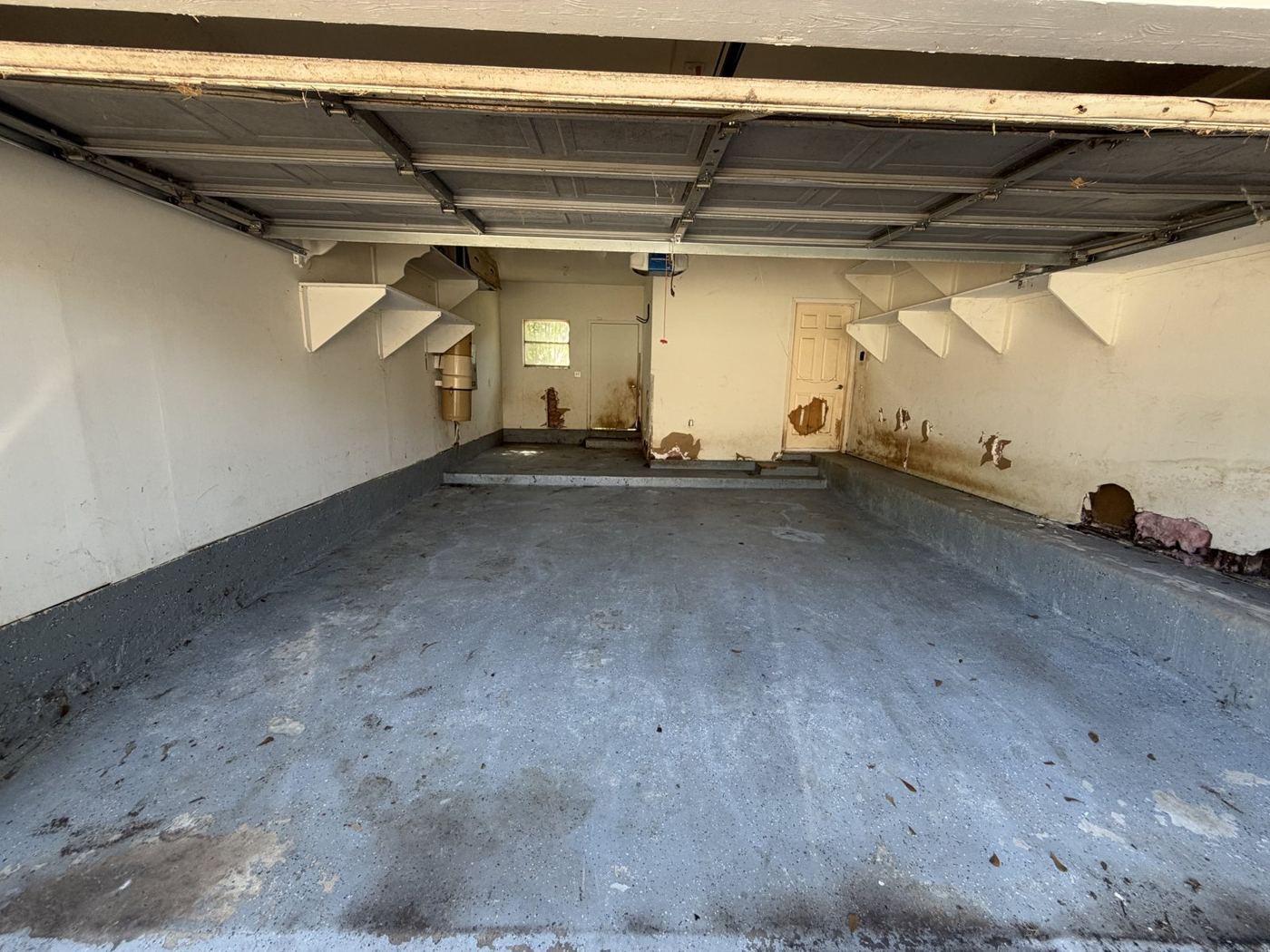 After: the same garage swept and empty